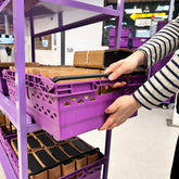 600mm x 400mm purple crate on a purple shelving unit in a warehouse